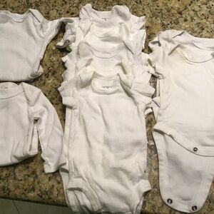 Carters and Gerber newborn onesies in white